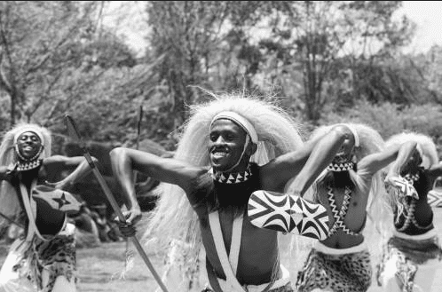 Burundian dance traditions — Intore warriors performing in full ceremonial costume"