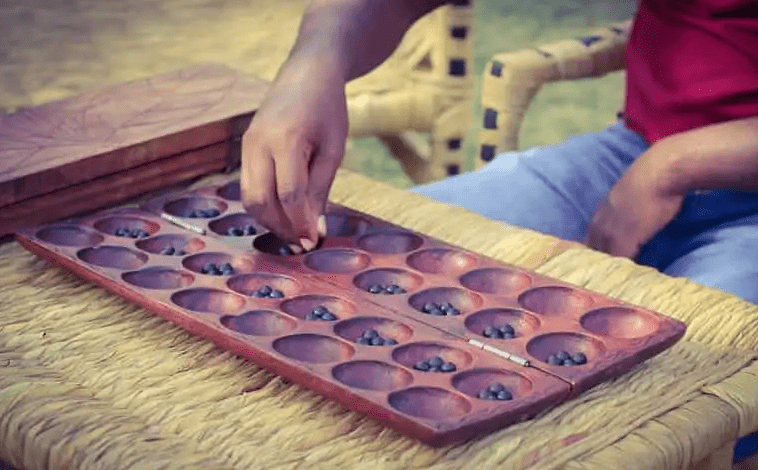 Living with Burundian Communities: Cultural Immersion Tours igishora traditional board game