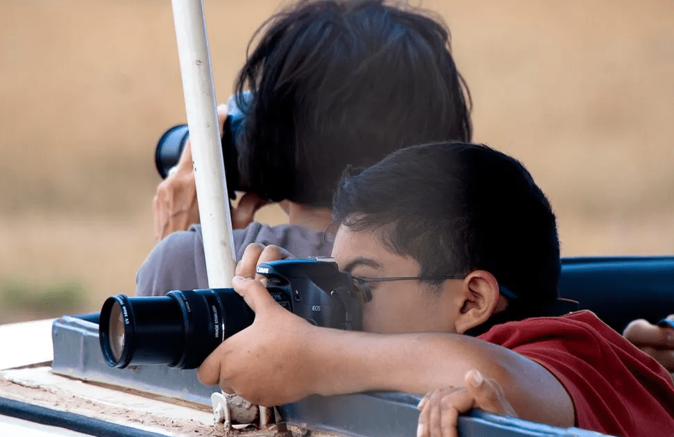Family Safari Rwanda-Burundi: Kid-Friendly Activities & Guide (2026). kids viewing animals on a safari