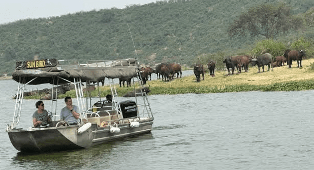 Navigating wetlands sustainably under Responsible Tourism in Burundi guidelines on a boat safari